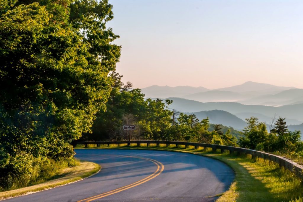 mountain road with sign